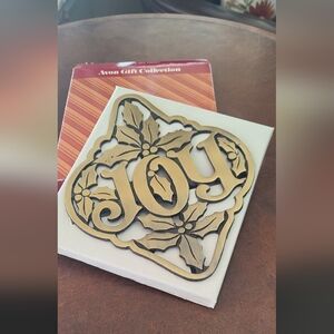 Avon holly and Joy metal trivet in original box